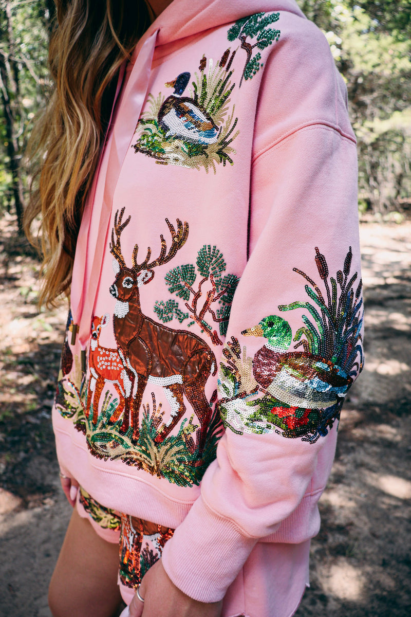 Close-up of the pink Bucks and Birds Hoodie with a beaded buck and mallard scene