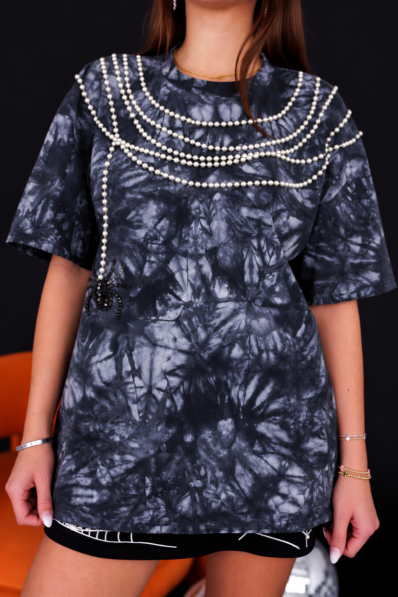 Model wearing the Itsy Bitsy Spider Pearl T-Shirt with a pearl spiderweb, front view