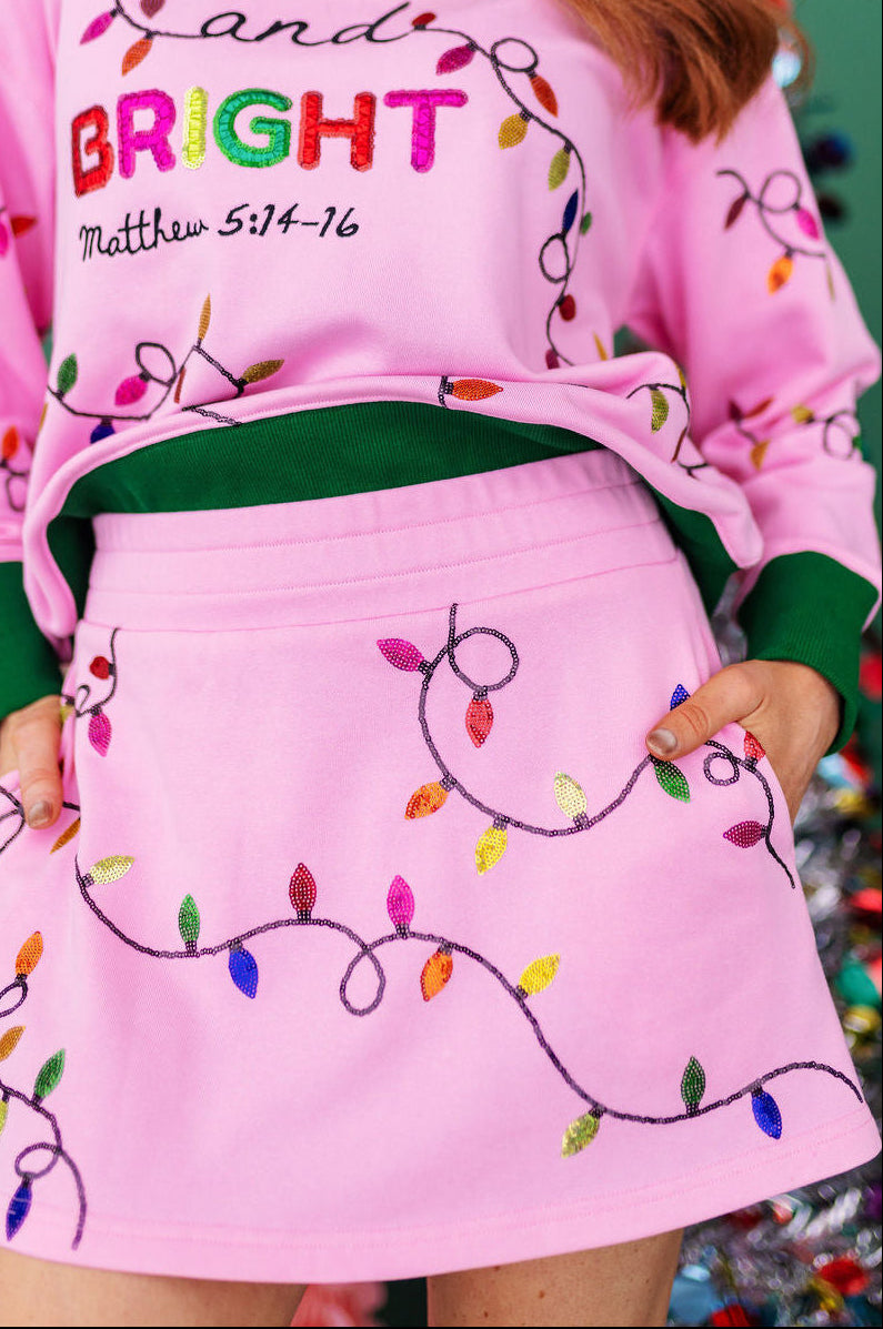 Pink Merry & Bright Christmas Lights Skirt/Skort with sequin lights, paired with the matching sweatshirt